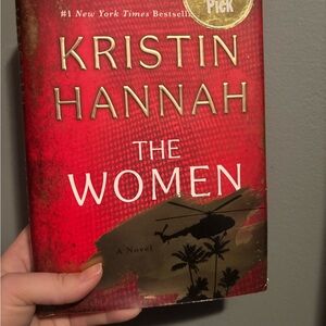 Red 'The Women' Book by Kristin Hannah